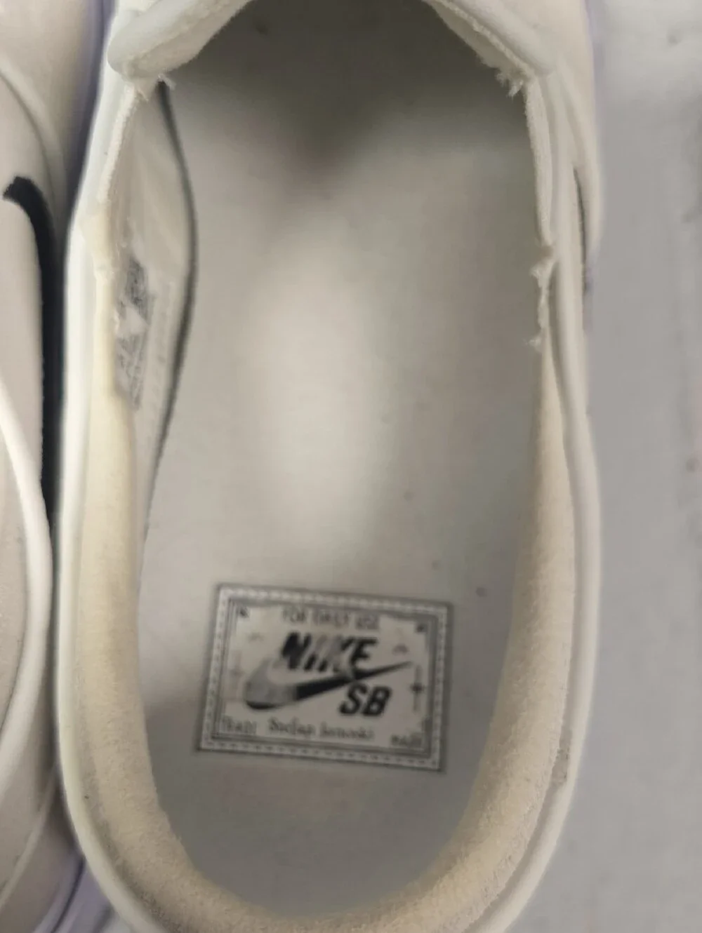 Nike Slip-On Sneakers in Off-White with Black Swoosh
